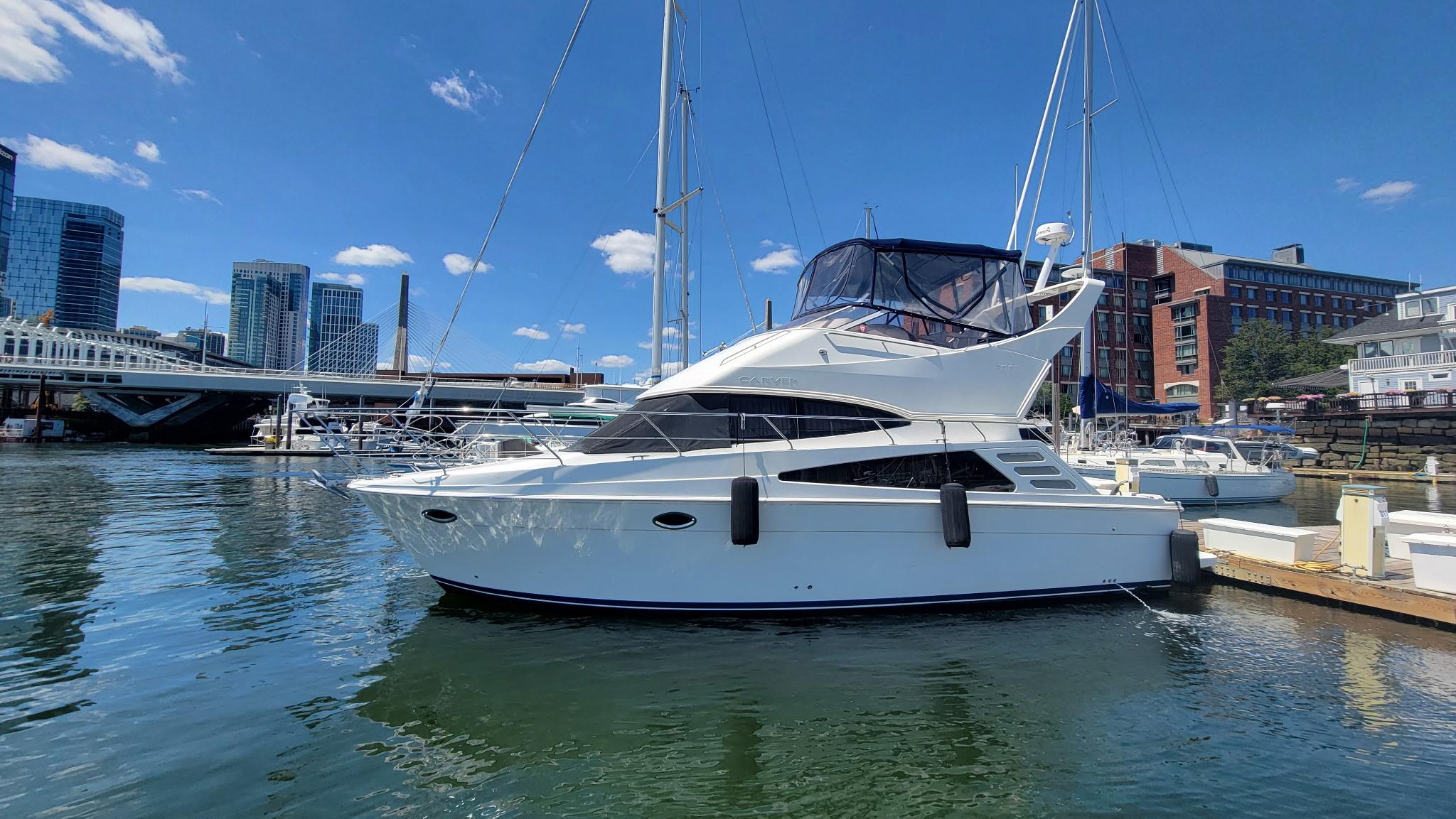 Carver 35 Super Sport 2007 Carver 35 Super Sport yacht docked in urban marina, city skyline in background.