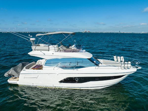 Prestige 420 2020 Prestige 420 yacht cruising on open water under clear blue skies.