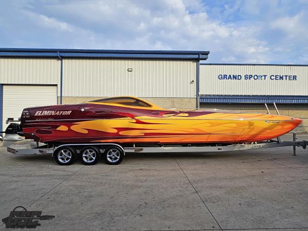 Eliminator 36 Daytona Coupe 2008 Eliminator 36 Daytona Coupe with vibrant flame design on trailer at Grand Sport Center.