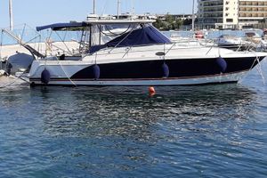 Faeton 1180 2008 Faeton 1180 boat docked in a marina with calm water reflections.