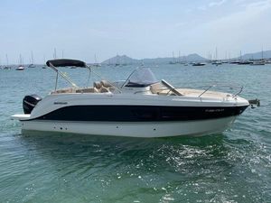 Quicksilver Activ 805 Sundeck 2017 Quicksilver Activ 805 Sundeck boat on calm water with distant sailboats.