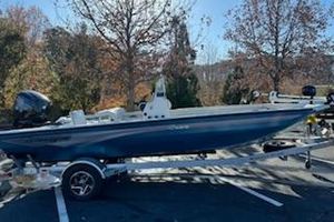 Ranger RB190 2024 Ranger RB190 boat on trailer, parked outdoors with autumn trees in background.
