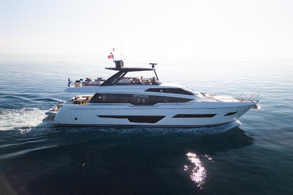 Ferretti Yachts 780 2021 Ferretti Yachts 780 cruising on calm ocean waters.