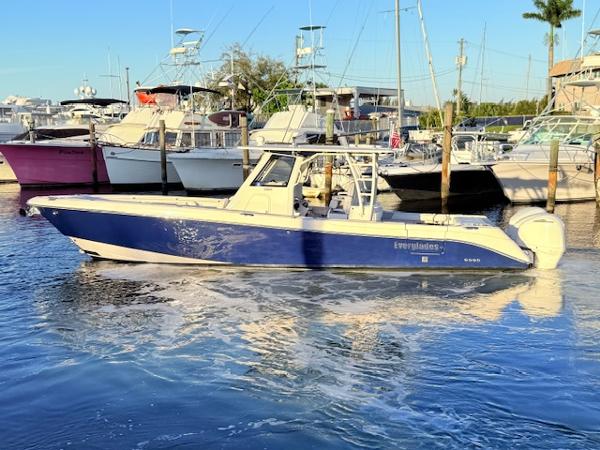 Everglades 355 Center Console 2014 Everglades 355 Center Console boat docked in marina, blue and white design.