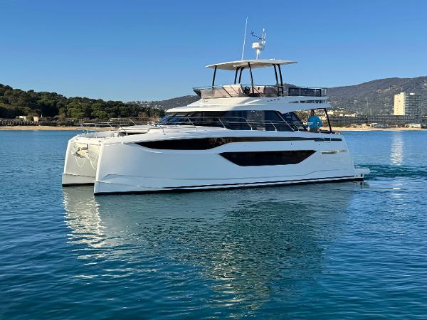 Prestige M48 2025 Prestige M48 yacht on calm water, showcasing sleek design and modern features.