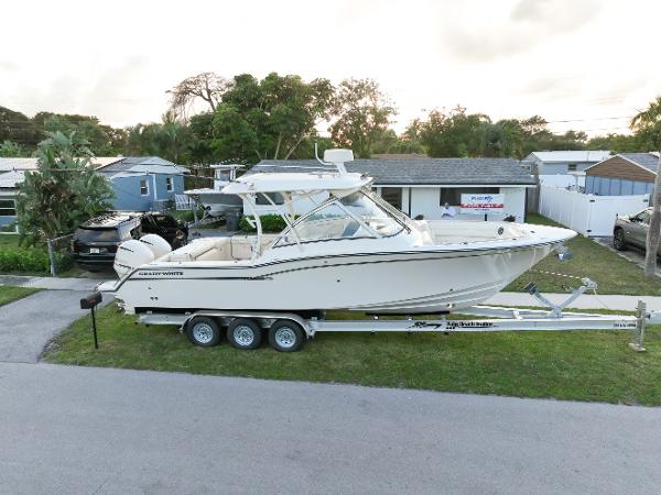 Grady-White Freedom 325 2019 Grady-White Freedom 325 boat on trailer, parked in residential area.