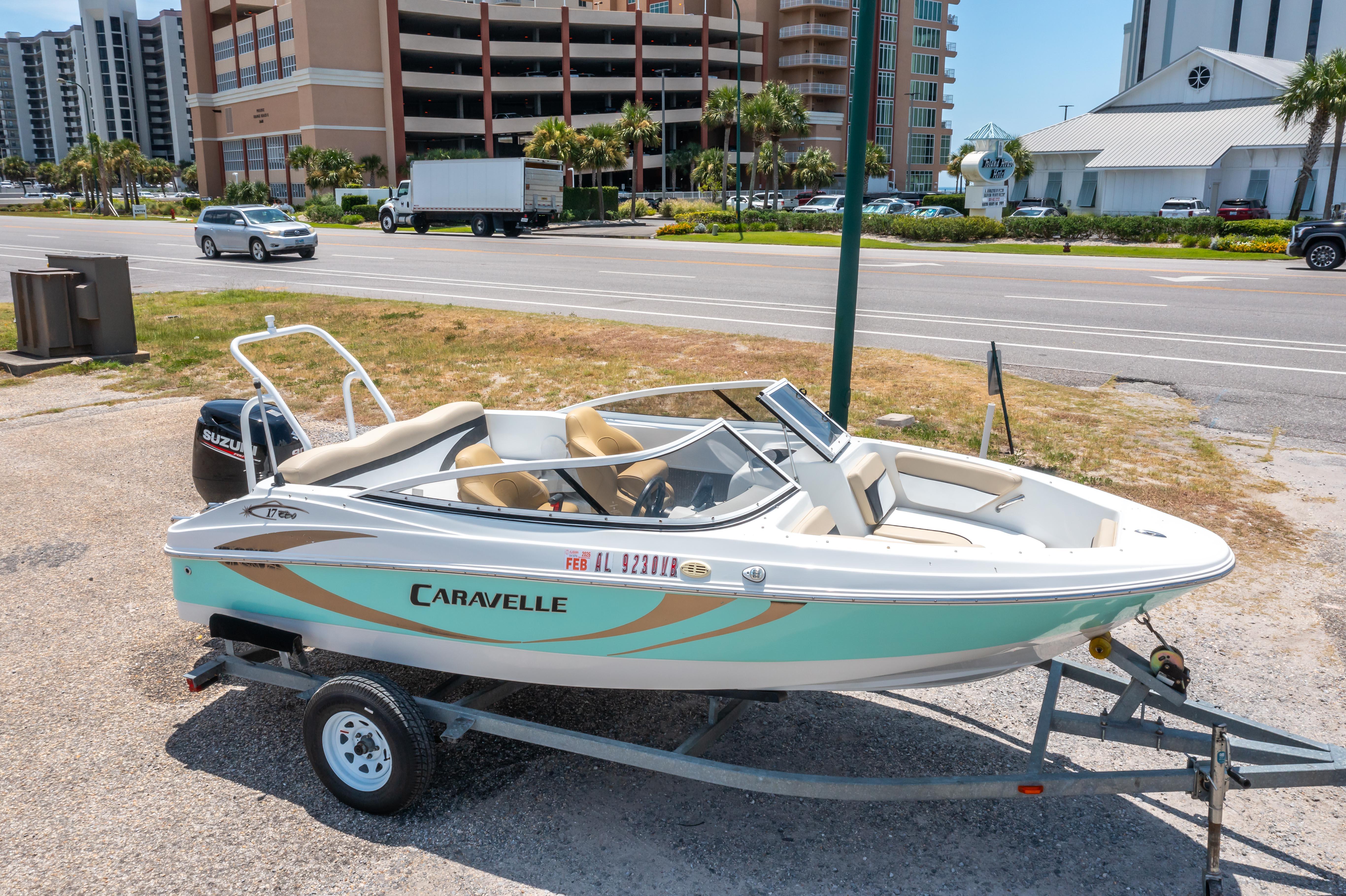 Caravelle 17 EBo Bowrider 2018 Caravelle 17 EBo Bowrider boat on trailer, parked near a road.
