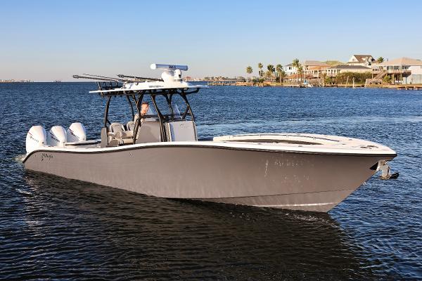 Yellowfin 36 Offshore 2023 Yellowfin 36 Offshore boat cruising on a calm lake.