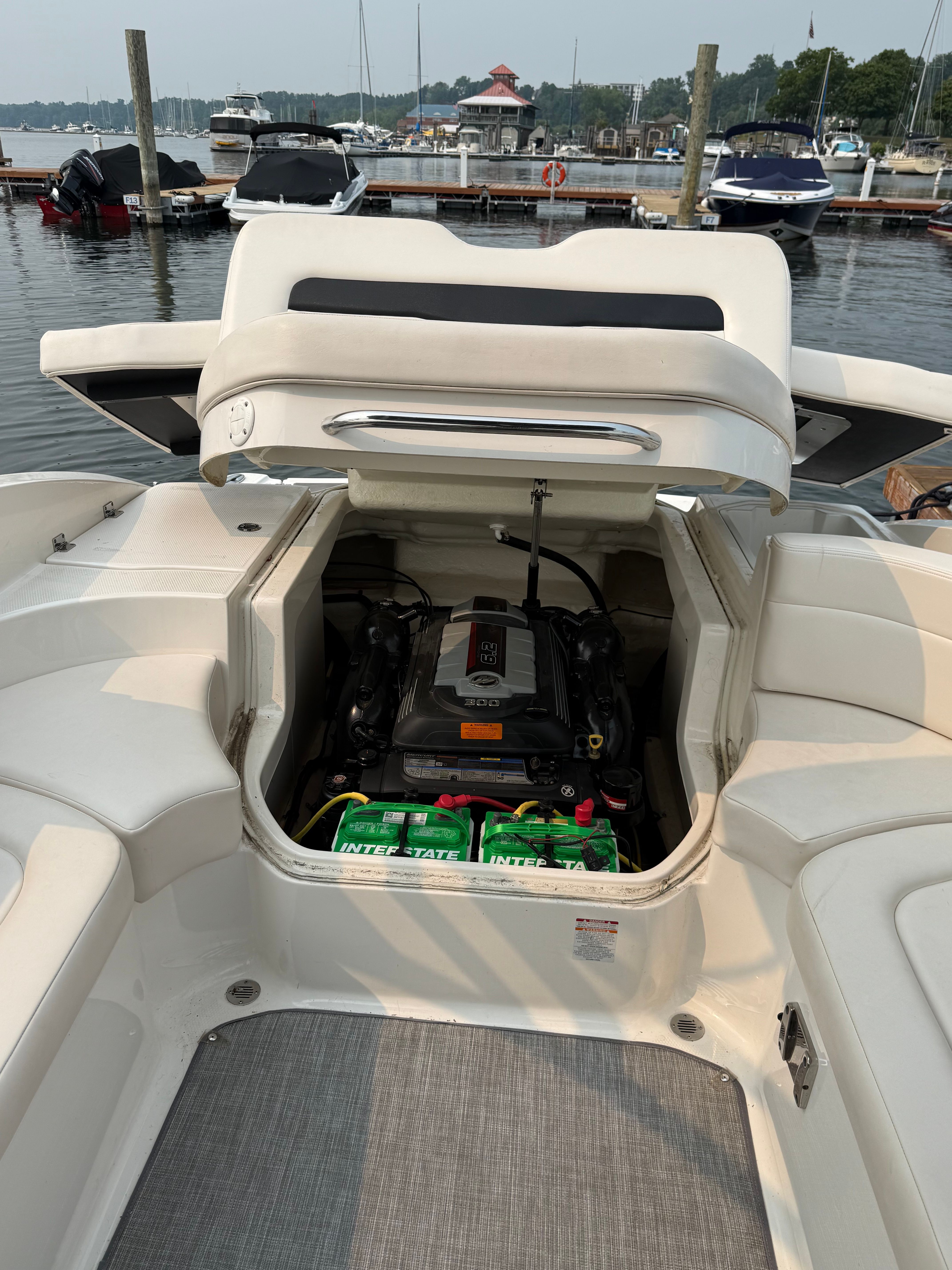 Chaparral 246 SSi 2017 Chaparral 246 SSi boat engine compartment open at marina.