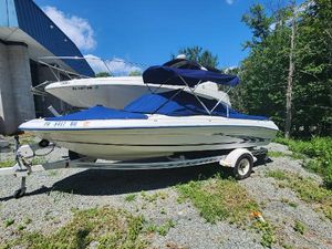 Sea Ray 175 Five Series 1997 Sea Ray 175 Five Series boat on trailer, blue cover, parked outdoors.