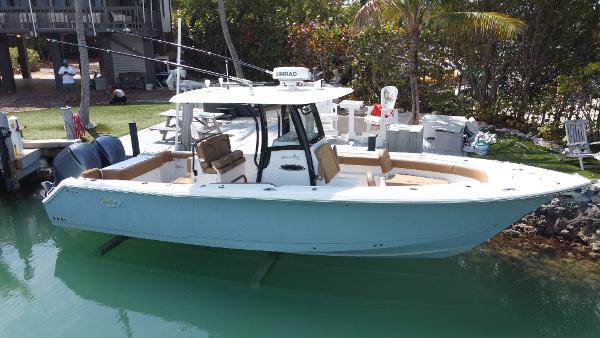 Sea Hunt Gamefish 30 Forward Seating 2020 Sea Hunt Gamefish 30 Forward Seating boat docked in clear water.