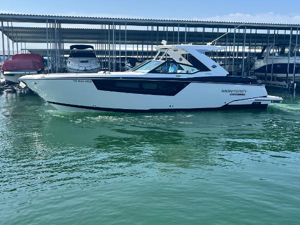 Monterey 378 SE 2018 Monterey 378 SE boat docked in marina, side view.