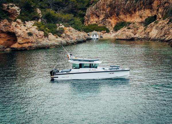 Axopar 29 XC Cross Cabin 2025 Axopar 29 XC Cross Cabin boat in scenic rocky cove.