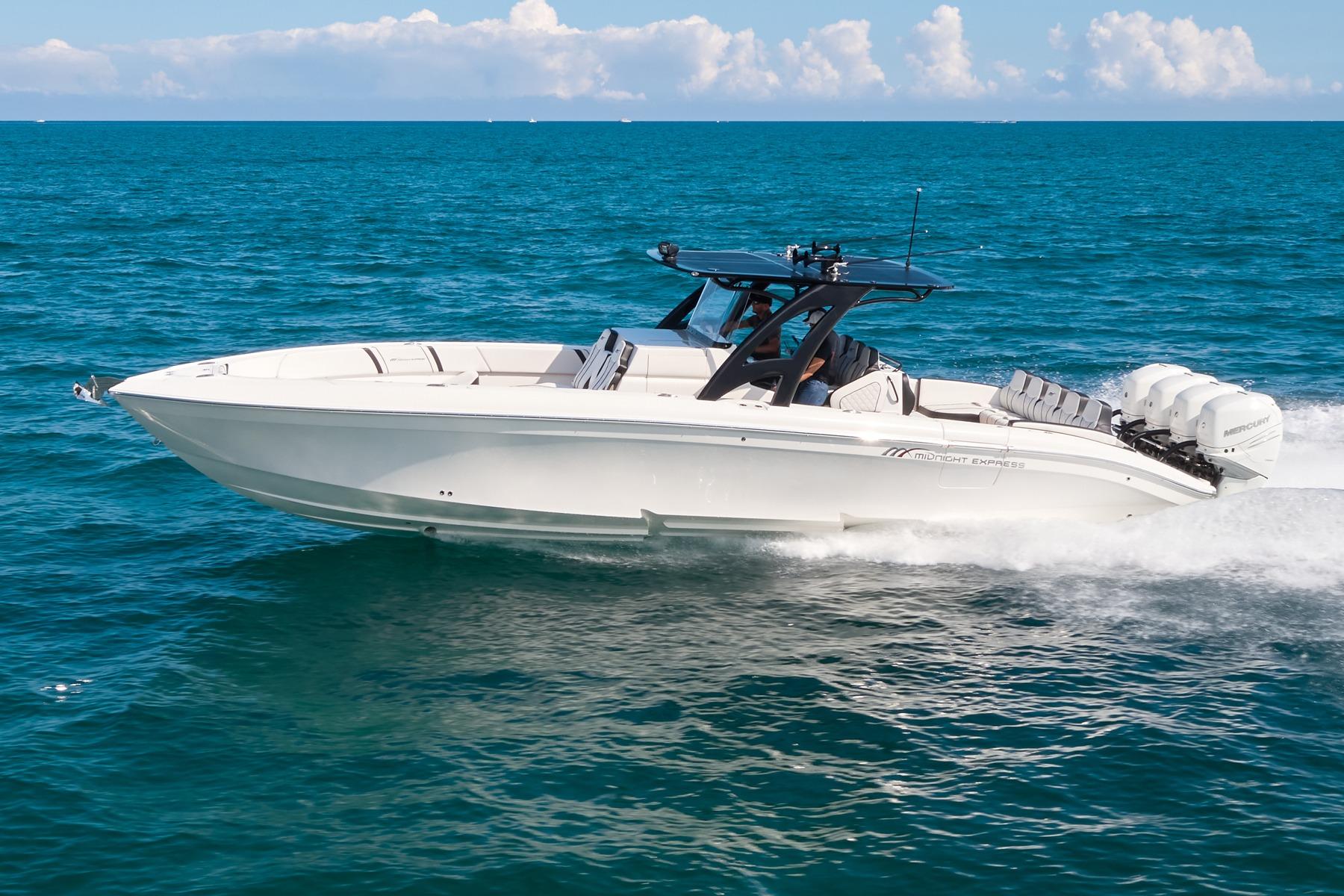 Midnight Express 37' Open 2020 Midnight Express 37' Open boat cruising on blue ocean waters.