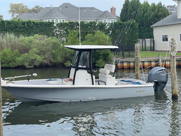 Sea Hunt BX 22 BR 2022 Sea Hunt BX 22 BR boat docked in a serene waterfront setting.