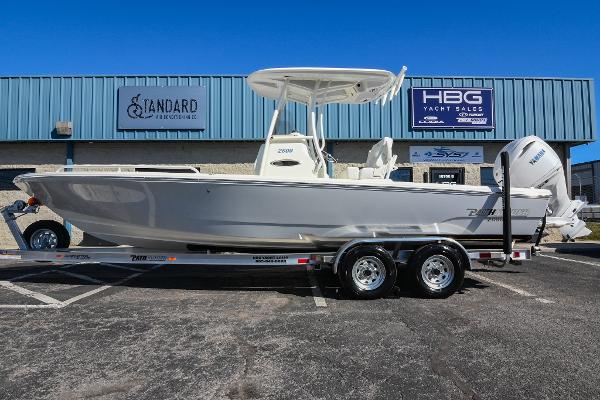 Pathfinder 2600 TRS 2025 Pathfinder 2600 TRS boat on trailer, parked outside yacht sales building.