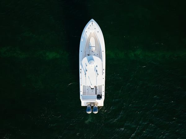 Contender 32 ST Aerial view of 2015 Contender 32 ST boat on dark green water.