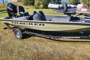 Tracker Pro Team 175 Crappie Edition 2026 Tracker Pro Team 175 Crappie Edition boat on trailer, parked on grass.