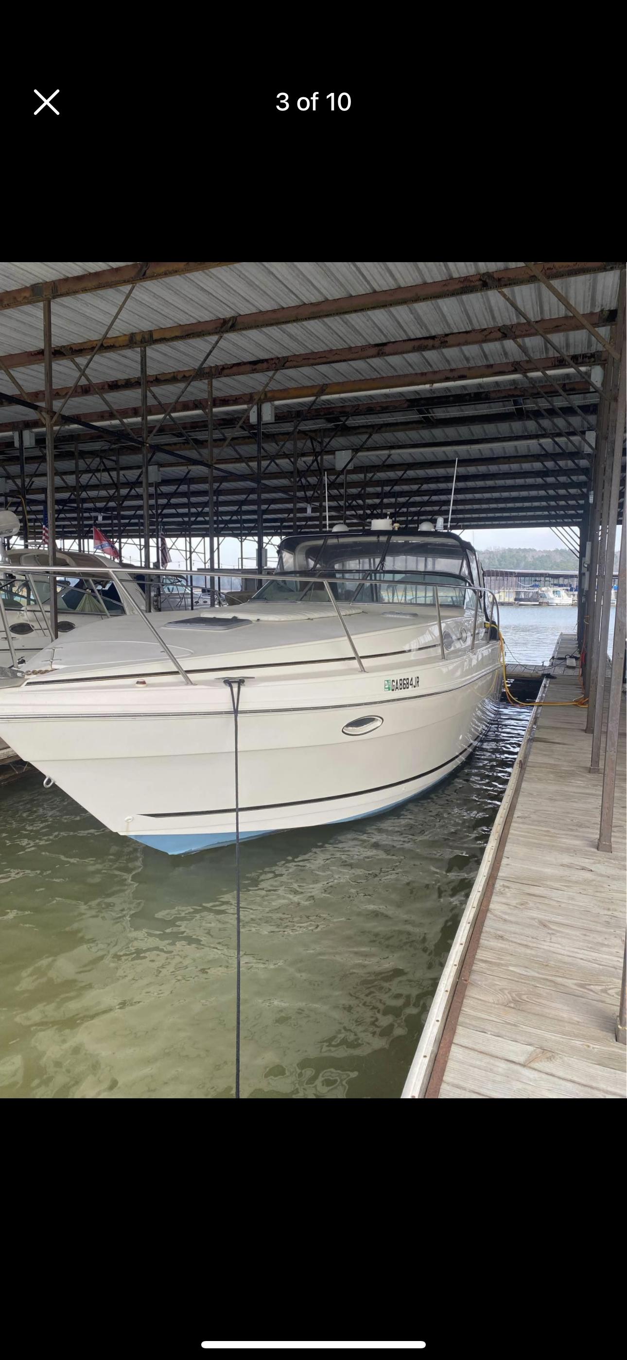 Rinker Fiesta 340 2000 Rinker Fiesta 340 boat docked in covered marina.