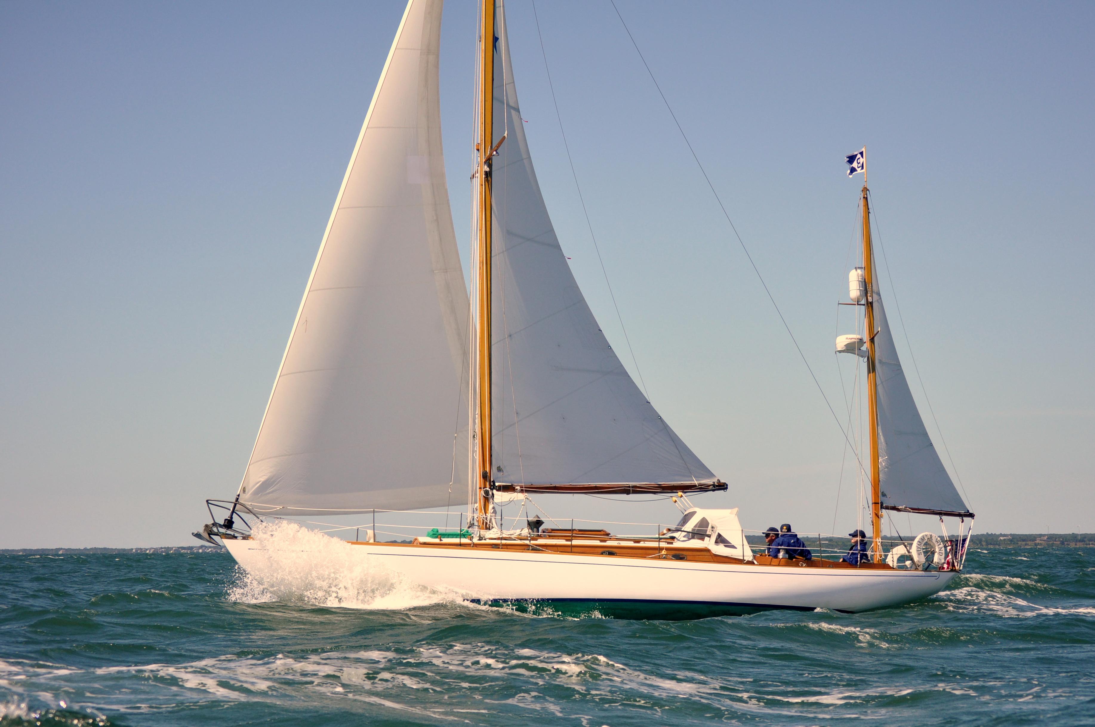 Concordia 39 Classic 1964 Concordia 39 sailboat navigating ocean waves under clear skies.