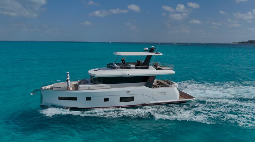 Sirena 58 2019 Sirena 58 yacht cruising on turquoise ocean under clear skies.
