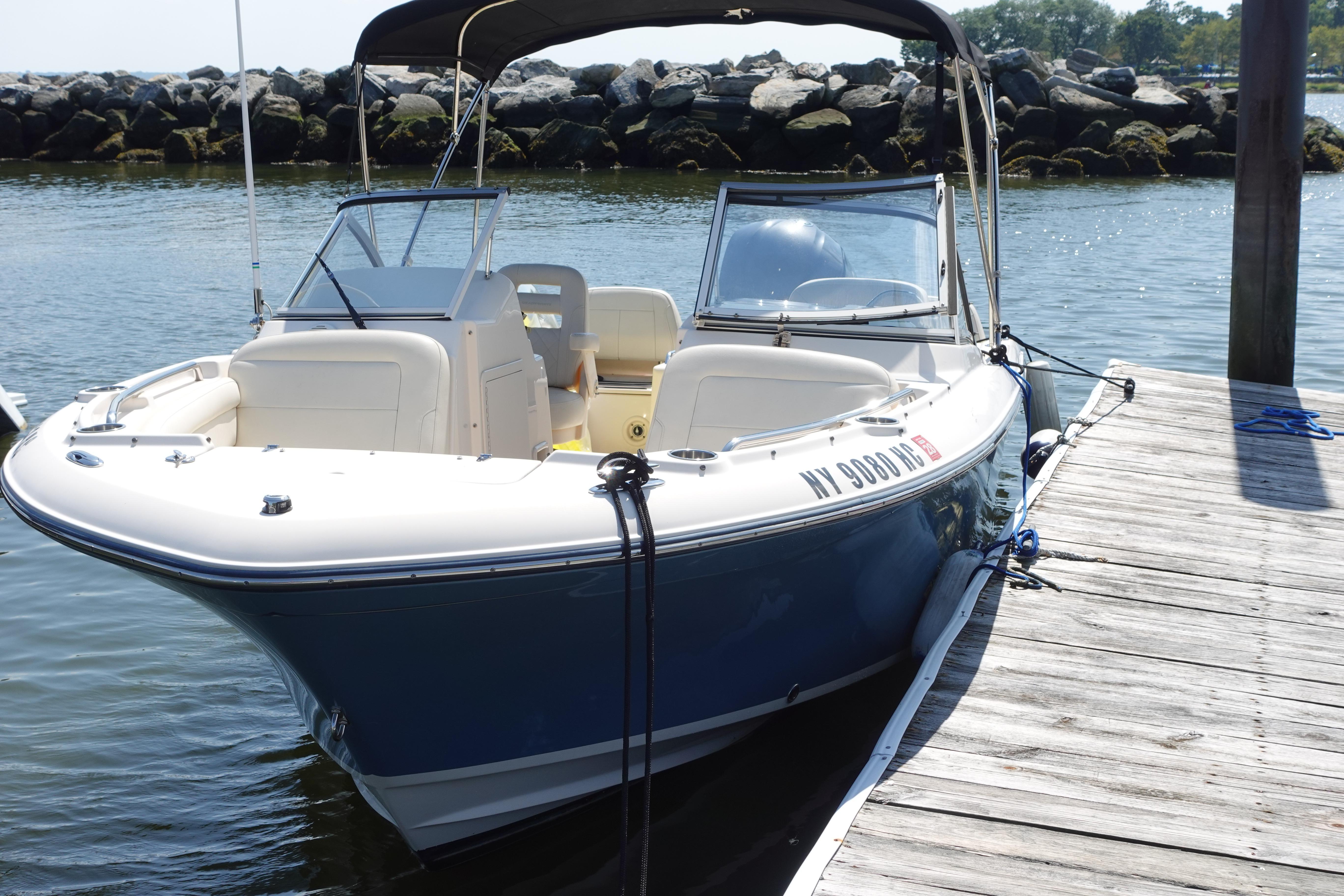 Grady-White Freedom 215 2020 Grady-White Freedom 215 boat docked by a wooden pier.