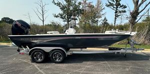Ranger RB200 2024 Ranger RB200 boat on trailer, parked outdoors, side view.