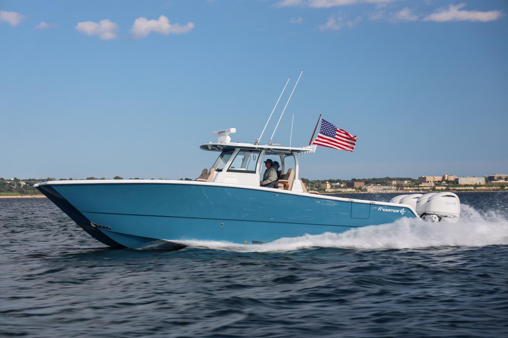 Freeman 38 2026 Freeman 38 boat cruising on water with American flag.