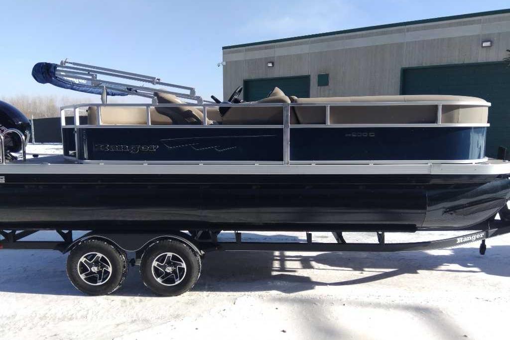 Ranger Reata 200C 2024 Ranger Reata 200C pontoon boat on trailer, parked outdoors.