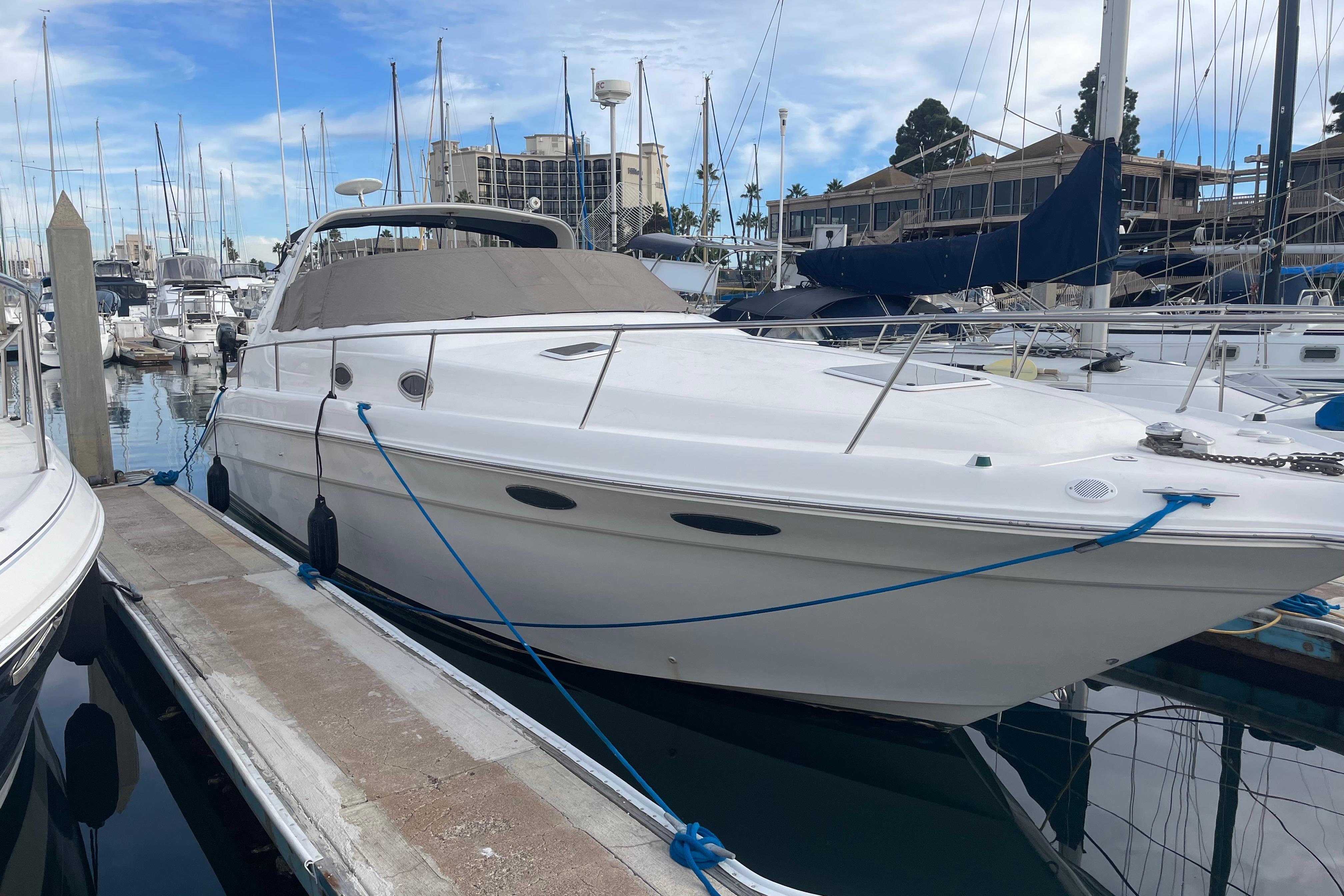 Sea Ray 330 Sundancer 1999 Sea Ray 330 Sundancer yacht docked in marina, surrounded by other boats.