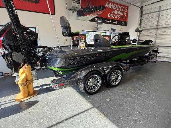 Nitro Z21 XL Pro 2025 Nitro Z21 XL Pro boat in showroom, featuring sleek design and dual-axle trailer.