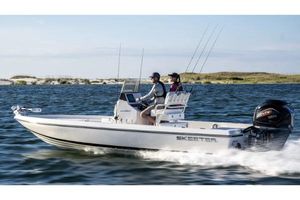 Skeeter SX230 Manufacturer Provided Image: 2026 Skeeter SX230 boat cruising on open water with two passengers.