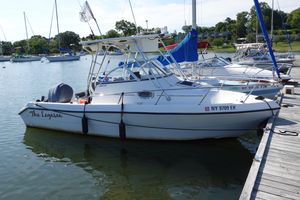 Pro Sports 2250 2004 PROSPORT 2250 boat named "The Legasea" docked at a marina.