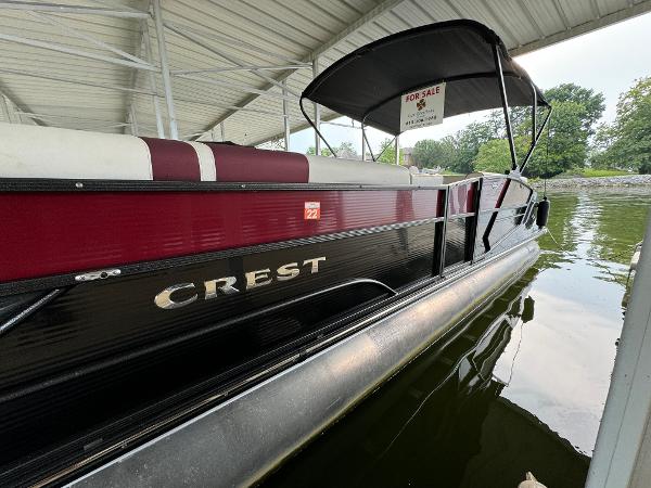 Crest Caribbean 250 SLRC 2019 Crest Caribbean 250 SLRC pontoon boat for sale under covered dock.