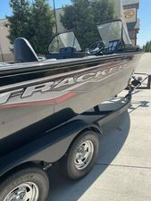 Tracker Targa V-18 WT 2024 Tracker Targa V-18 WT boat on a trailer in a parking lot.