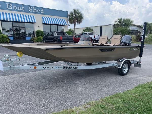 SeaArk Shadow 17 Side Console 2025 SeaArk Shadow 17 Side Console boat on trailer outside dealership.