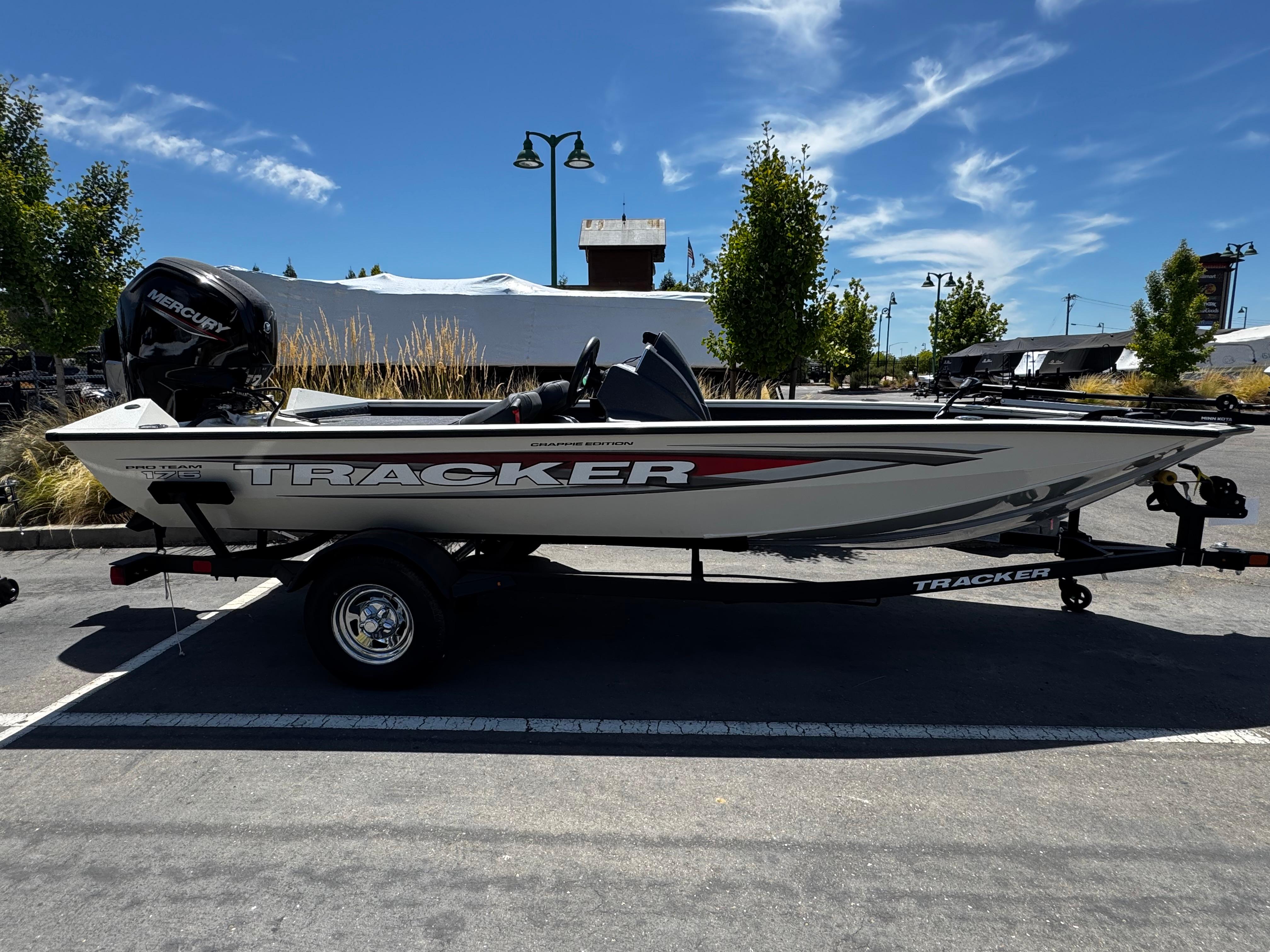 Tracker Pro Team 175 Crappie Edition 2025 Tracker Pro Team 175 Crappie Edition boat on trailer, parked outdoors.