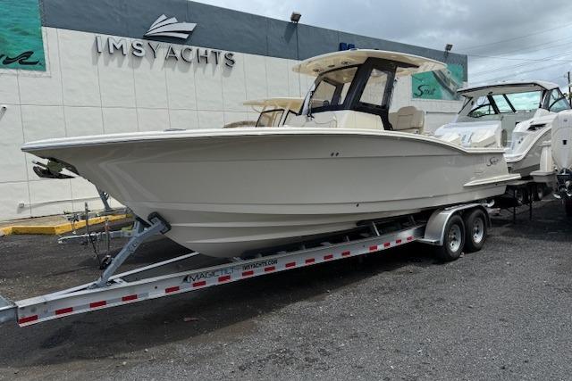 Scout 288 LXF 2026 Scout 288 LXF boat on trailer at IMS Yachts dealership.