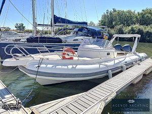 Capelli Tempest 900 WA 2016 Capelli Tempest 900 WA boat docked at marina, featuring sleek design and spacious deck.