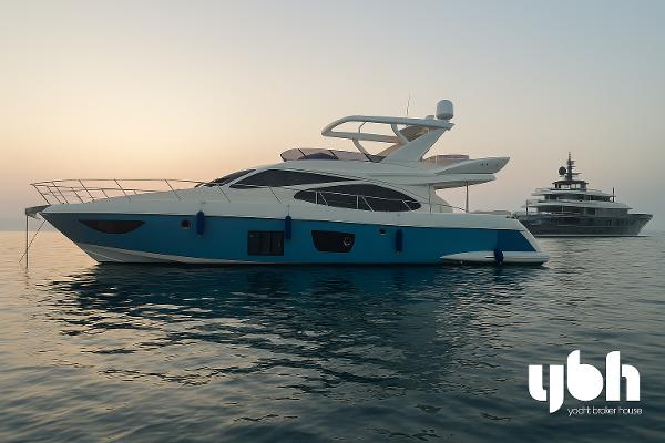 Azimut 70 2009 Azimut 70 yacht on calm water at sunset.