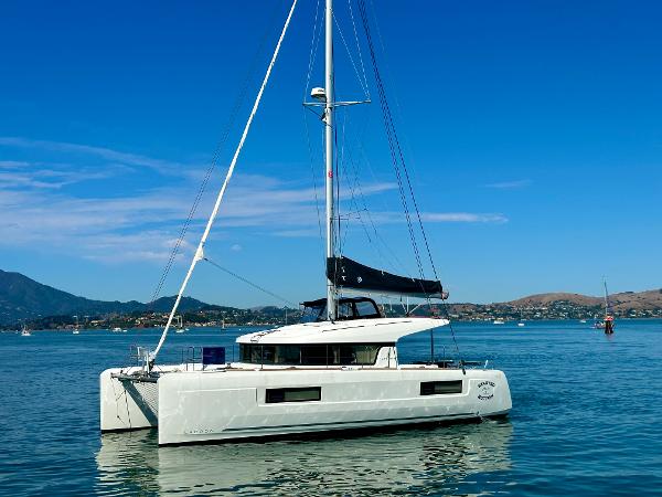 Lagoon 40 2020 Lagoon 40 catamaran sailing on calm waters under a clear blue sky.