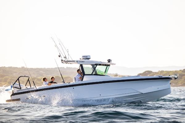 Axopar 29 CCX 2025 Axopar 29 CCX boat cruising on open water with passengers onboard.