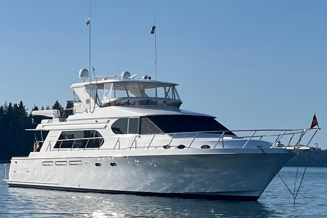 Ocean Alexander 64 Pilothouse 2004 Ocean Alexander 64 Pilothouse yacht on calm water, clear sky background.