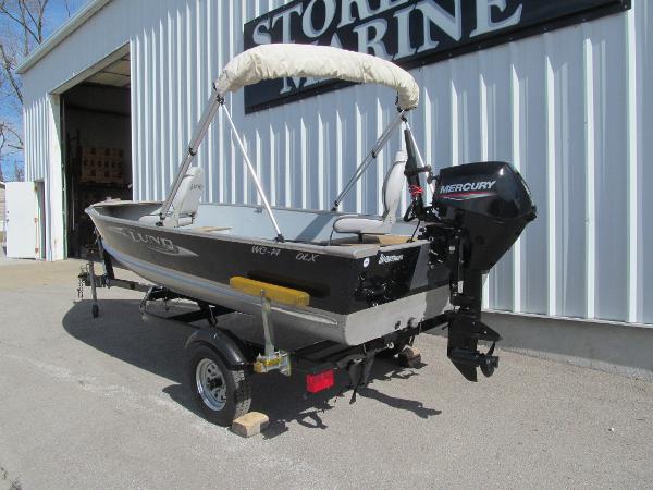 Lund WC 14 DLX Tiller 2010 Lund WC 14 DLX Tiller boat with Mercury outboard motor on trailer.