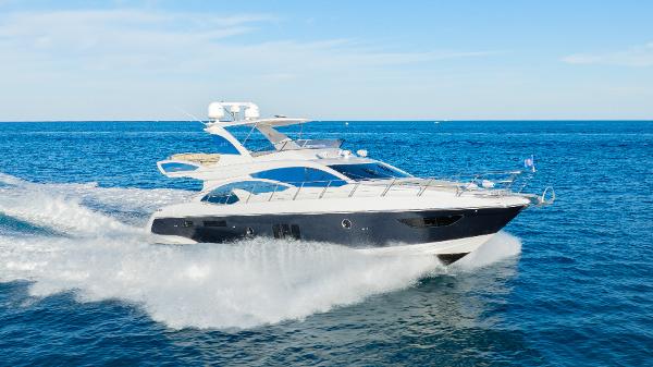 Azimut 60 Flybridge Azimut 60 Flybridge 2017 yacht cruising on open sea under clear blue sky.