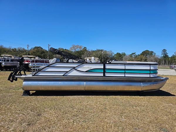 Bentley Pontoons LEGACY 243 QUAD SWINGBACK 2025 Bentley Pontoons LEGACY 243 QUAD SWINGBACK on grass under clear blue sky.