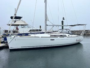 Beneteau Oceanis 37 2008 Beneteau Oceanis 37 sailboat docked in a marina on a cloudy day.