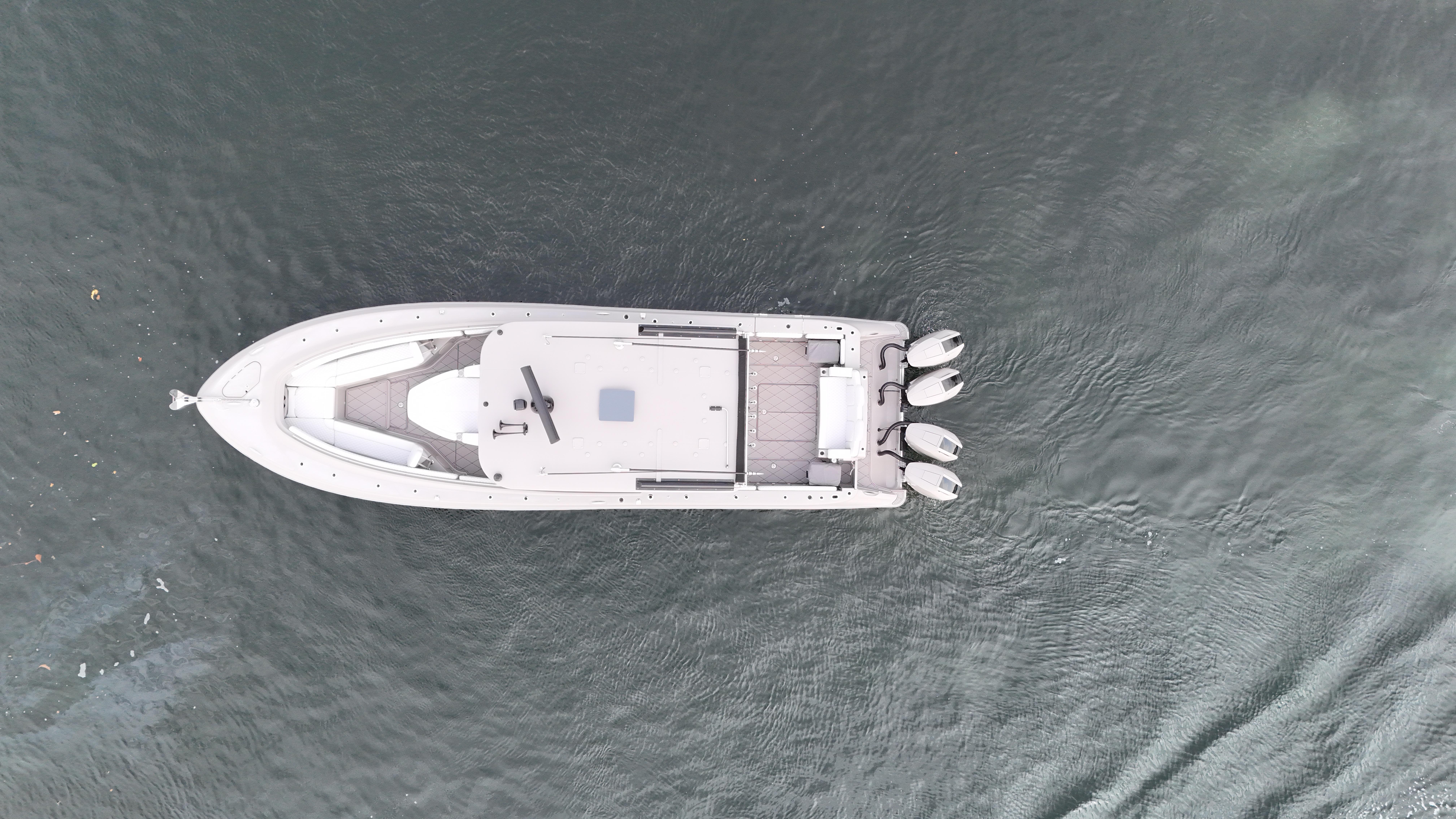 HCB Lujo Aerial view of 2024 HCB Lujo boat on water, showcasing sleek design and triple engines.