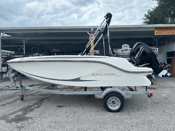 Bayliner Element M15 2025 Bayliner Element M15 boat on trailer, side view, outdoors.
