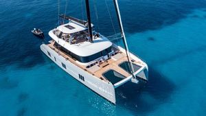 Sunreef 80 Sail Luxury Sunreef 80 Sail catamaran, 2022 model, cruising on clear blue waters.